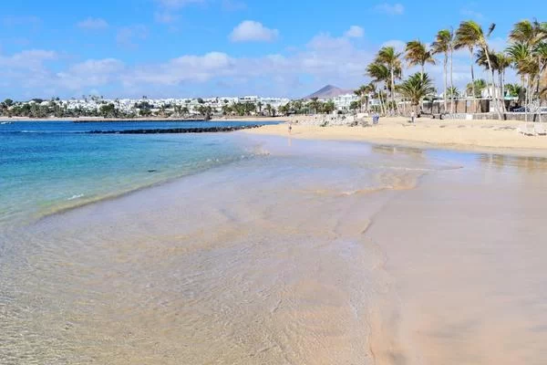 the clear waters and beach at costa teguise lanzarote